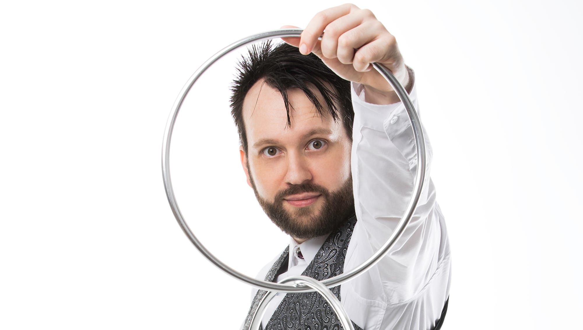 Gold Coast, Queensland comedy magician Blaze holding linking rings in front of white background