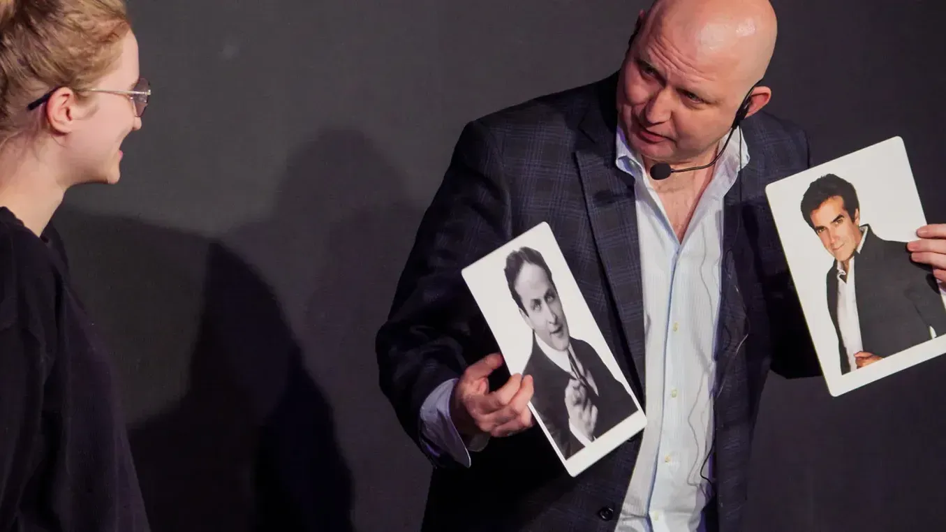 George Madrid performing magic tricks on stage in Boston 