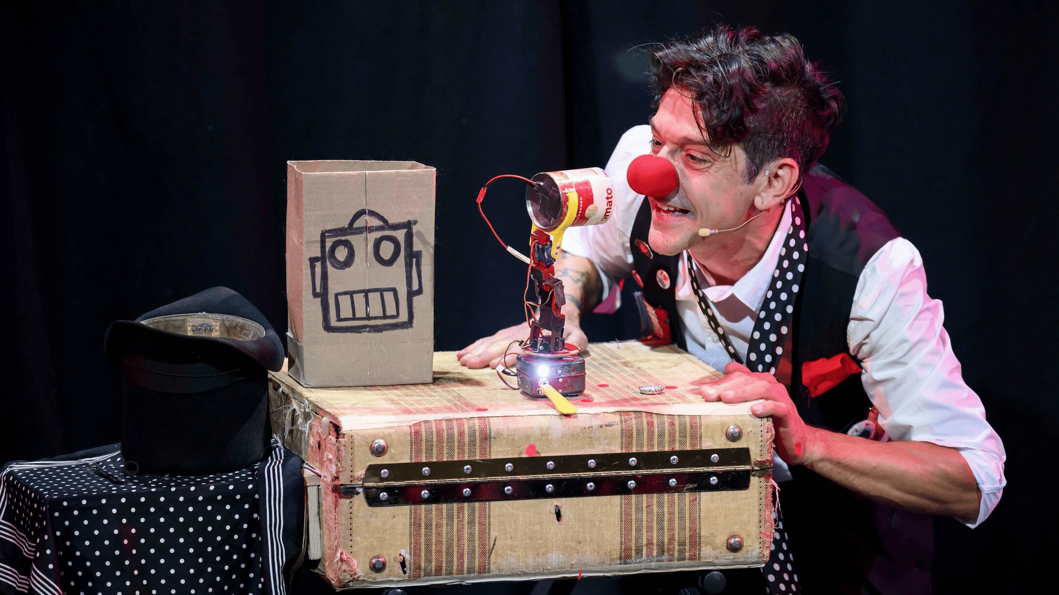 Mario the Maker Magician smiling at soup can robot wearing red nose