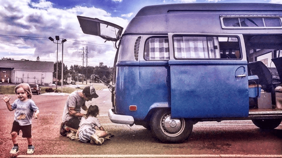 Marchese family fixing first tour bus on the road.