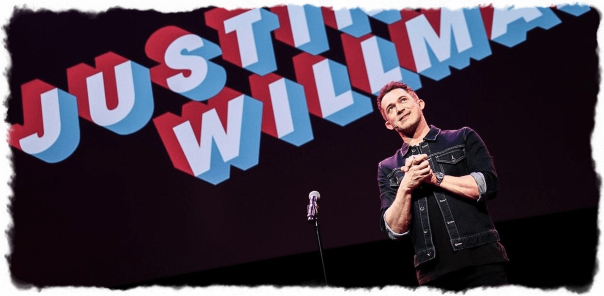 Justin Willman magician performing on stage 