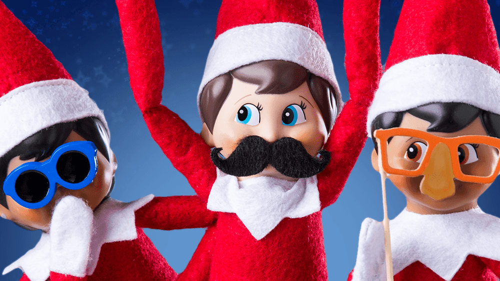 Three Elfs on the Shelf with funny disguises (moustaches and glasses)